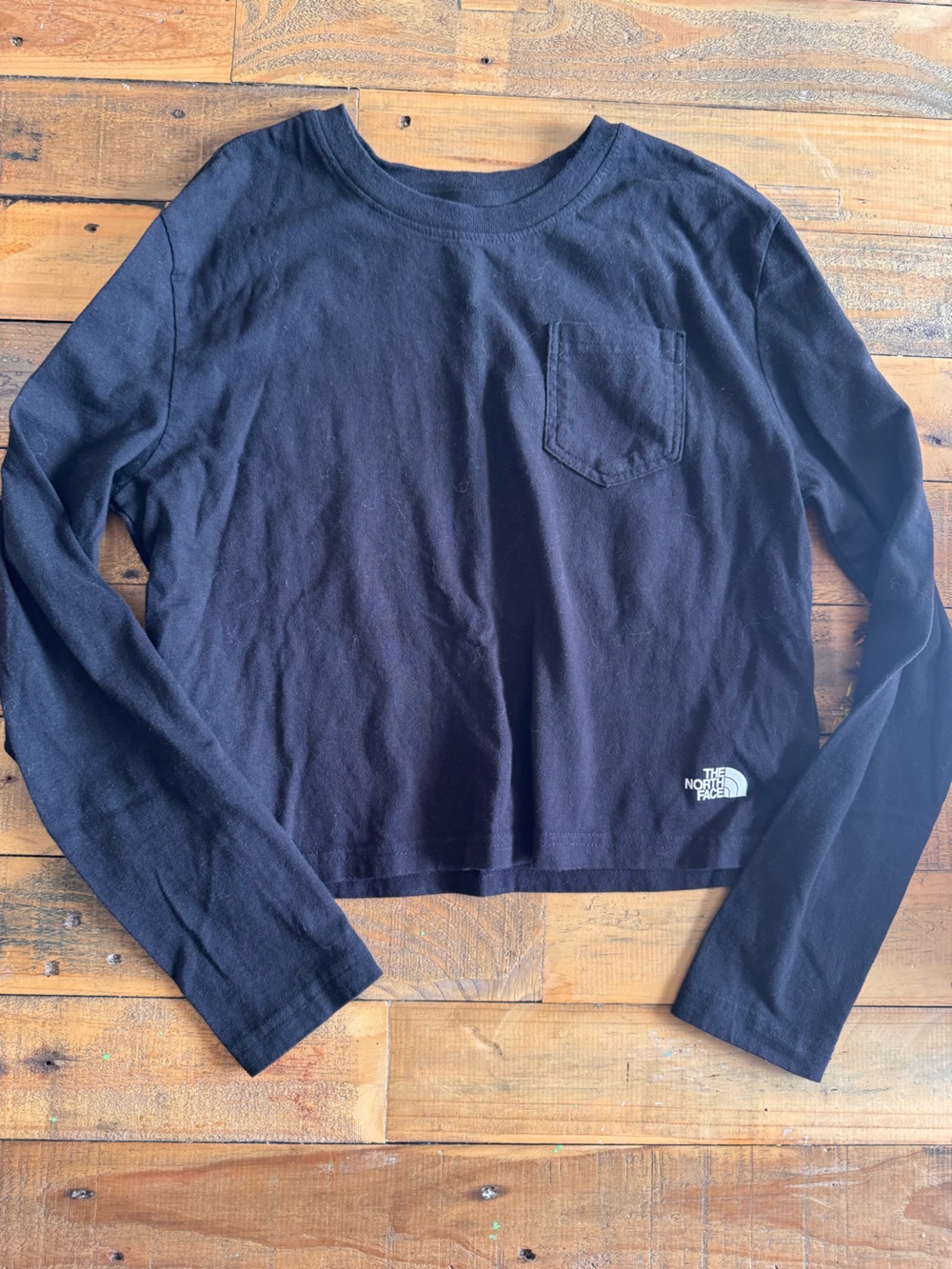 The north face black long sleeve pocket crop